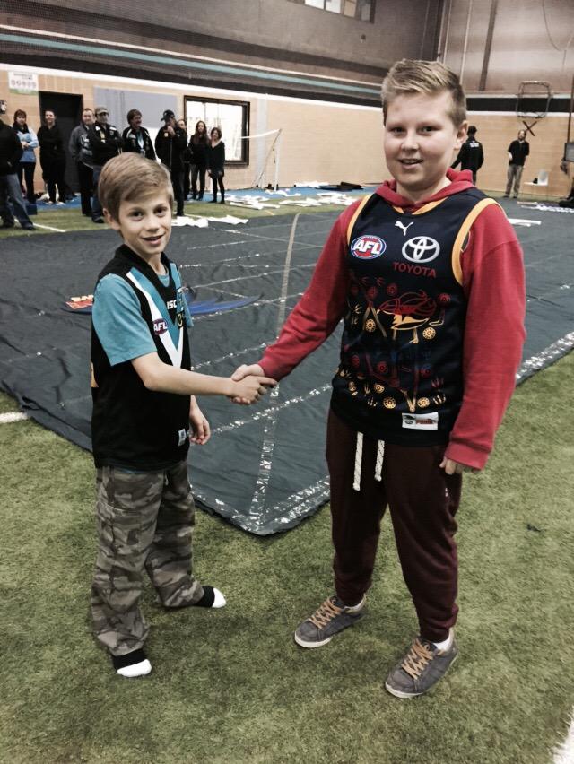 PAFC's tweet photo. Joint banner making with @Adelaide_FC tonight! #weareportadelaide #Showdown39 #weflyasone http://t.co/BHHaNglmc1