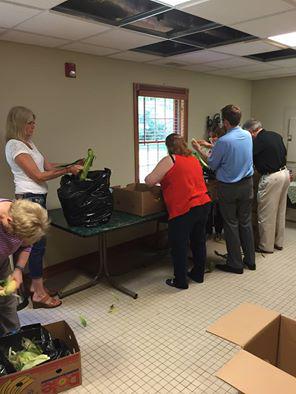Shucking corn today at #HIA for the annual cardboard regatta at Waldenwoods Resort tomorrow! Come out &amp; join the fun