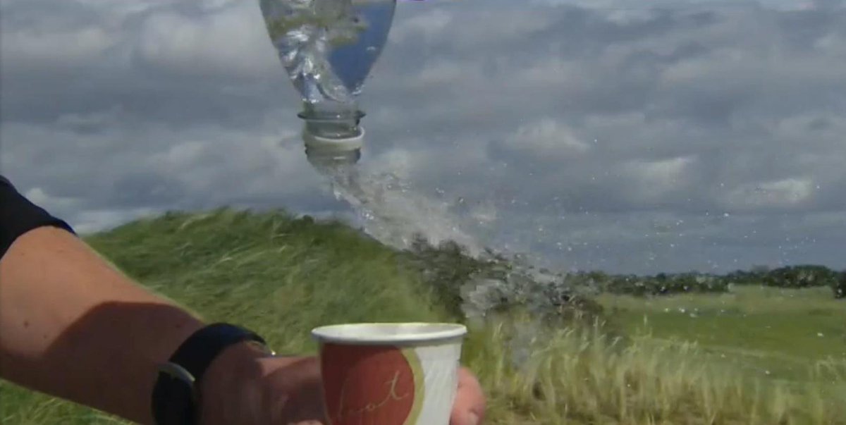ForTheWin's tweet photo. It's so windy at the British Open that people can't even pour water into cups http://t.co/kzLmreWYyJ http://t.co/6fvi9sijTw