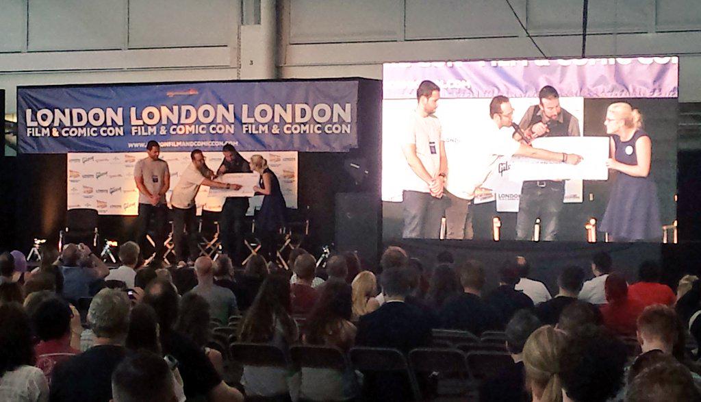 MichaelJFoxOrg's tweet photo. Makers of the #BTTF documentary Back in Time present @TEAMFOX with a cheque for $8888 following their talk at #LFCC http://t.co/vCCl33HQkO