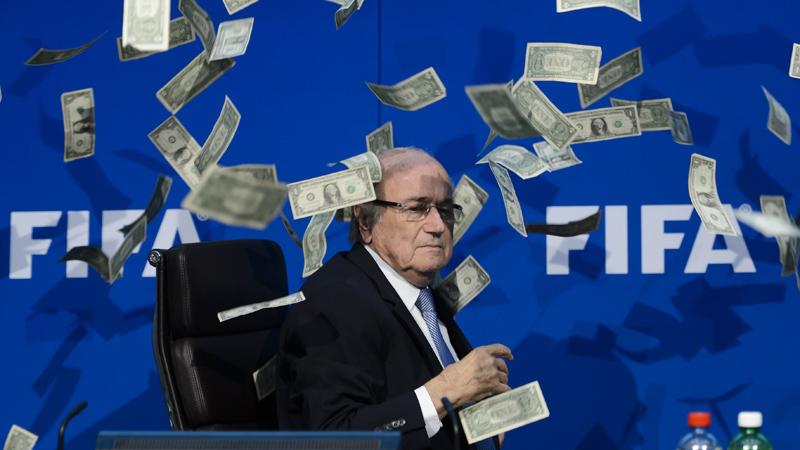 ESPNFC's tweet photo. Sepp Blatter news conference delayed by intruder throwing fake money at him. http://t.co/55odgHHMJB http://t.co/abwgVcNJ5J
