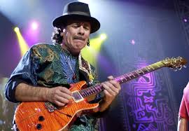 Happy 68th birthday, Carlos Santana.  Where would you rank him among all-time guitarists? Favorite song? 
