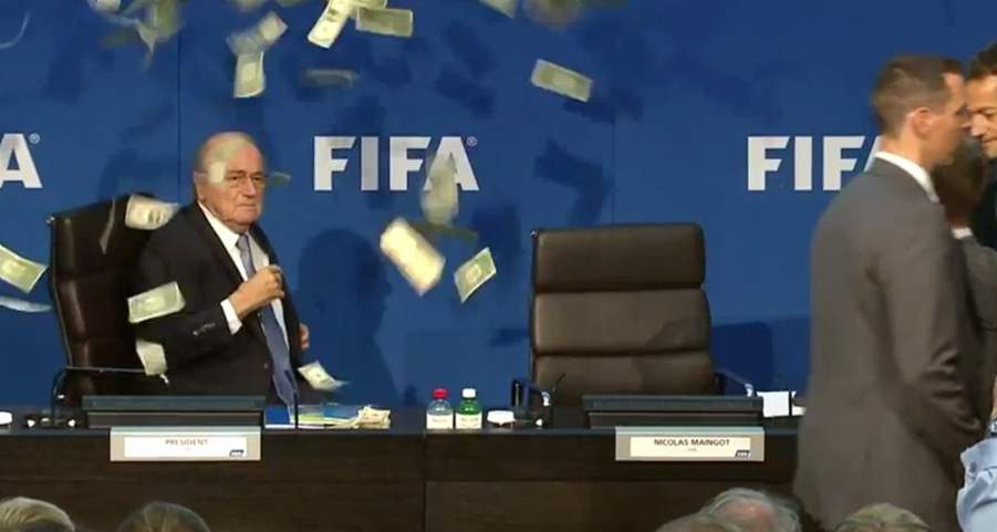 SkySportsNews's tweet photo. Sepp Blatter had to stop his news conference after having money thrown at him by prankster http://t.co/merfIcjU1h http://t.co/St3eVDv5fu