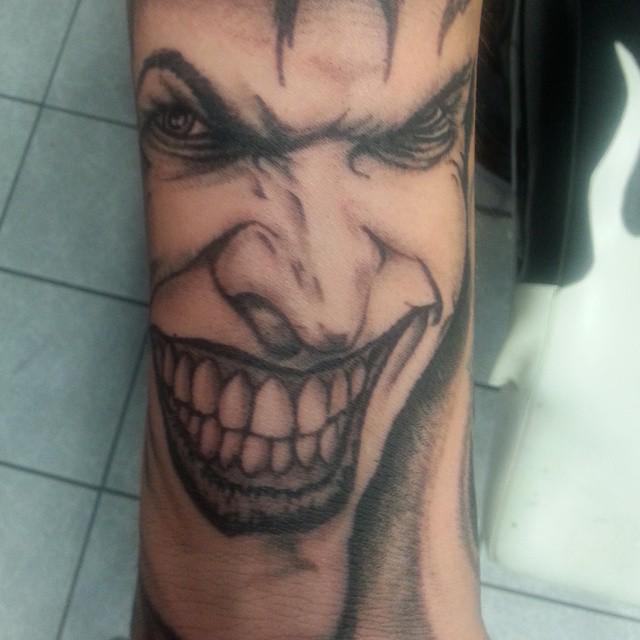 Red Ink Why So Serious Joker Tattoo With Smile On Chest – Truetattoos