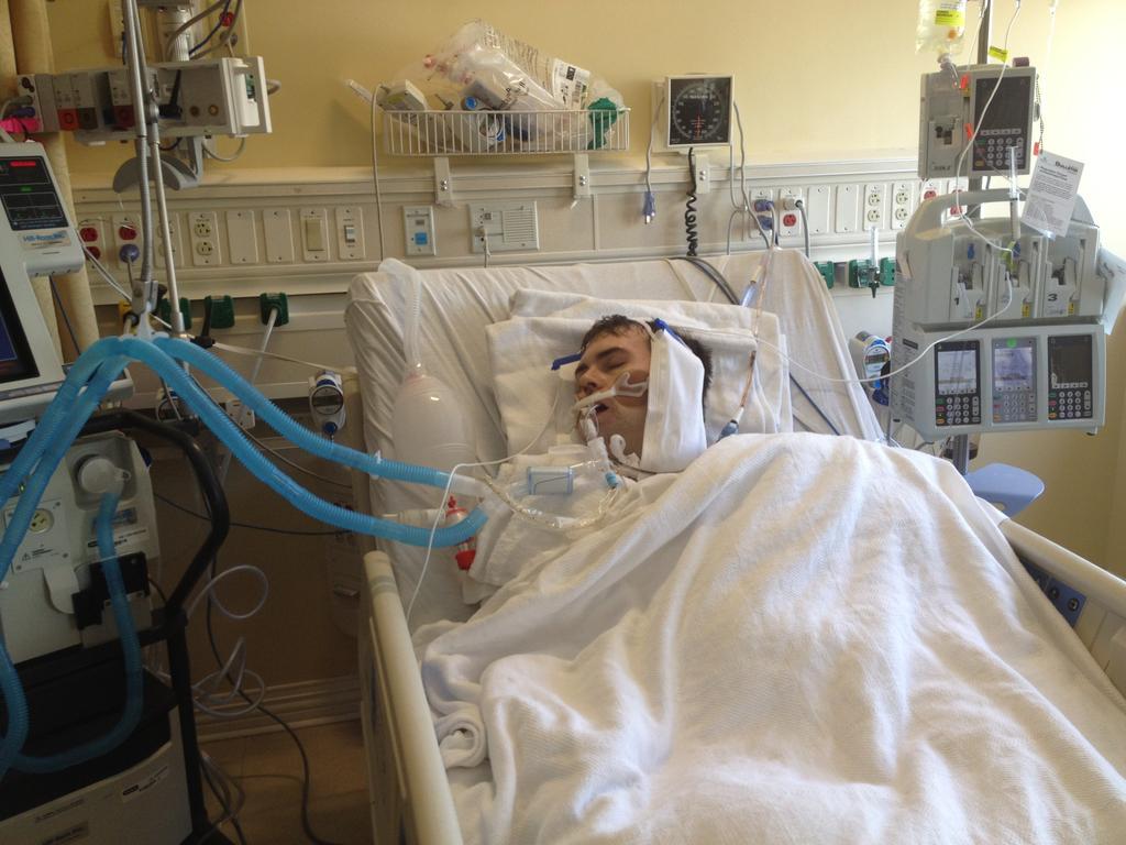 -I lay in my bed in the icu still in critical stable condition-