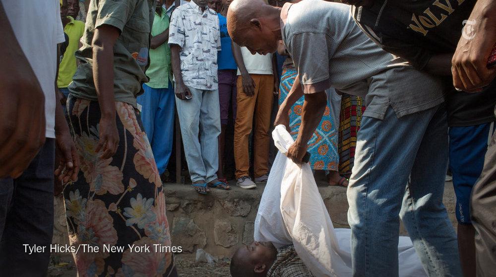 nytimesworld's tweet photo. The body of an opposition activist was found in a ditch on Tuesday as Burundians began voting http://t.co/3fIsFY9Yeb http://t.co/25mdDe8mIa