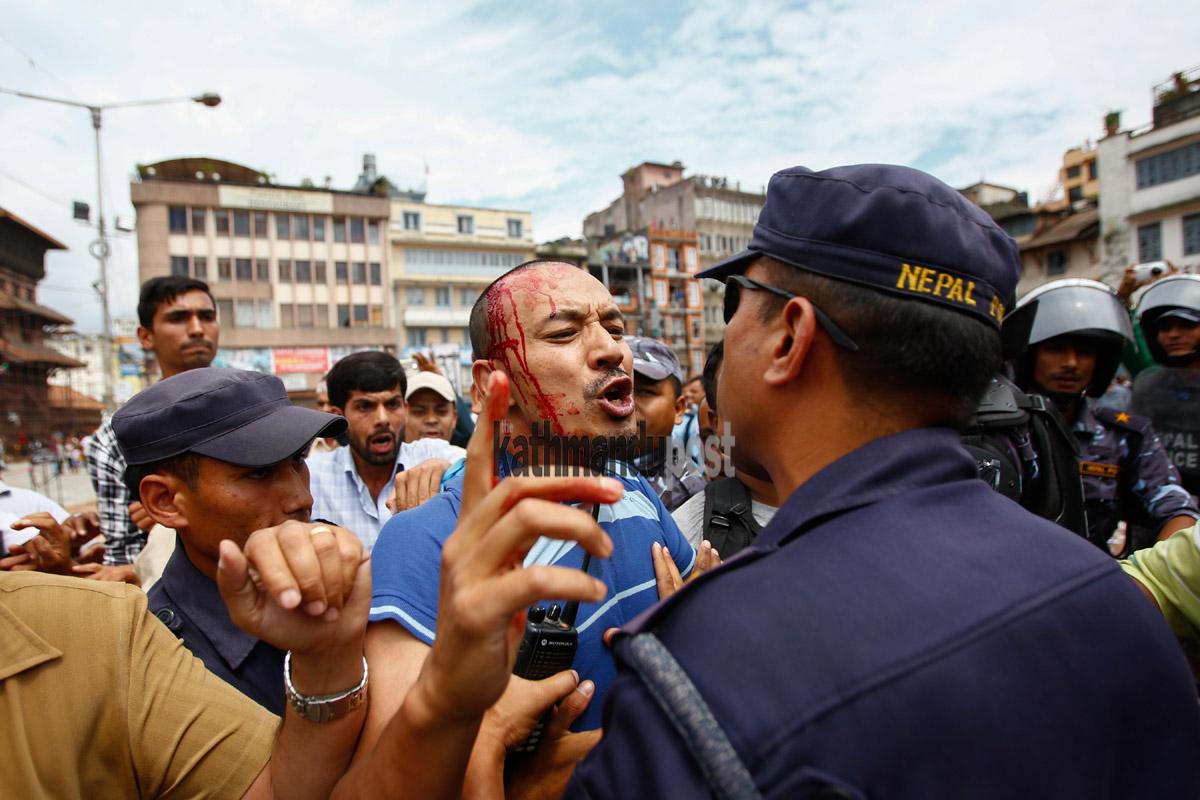 kathmandupost's tweet photo. A scene at Basantapur Durbar Square during public opinion collection on Tuesday. Cadres of RPP-N clashed with police. http://t.co/s69iaZUKYm