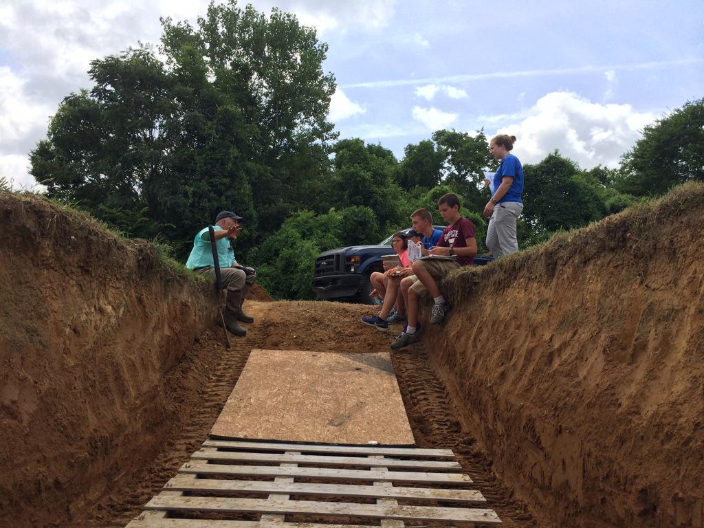 You know you have a deep soil pit when you have to lay pallets down to stay dry. #WaterTable