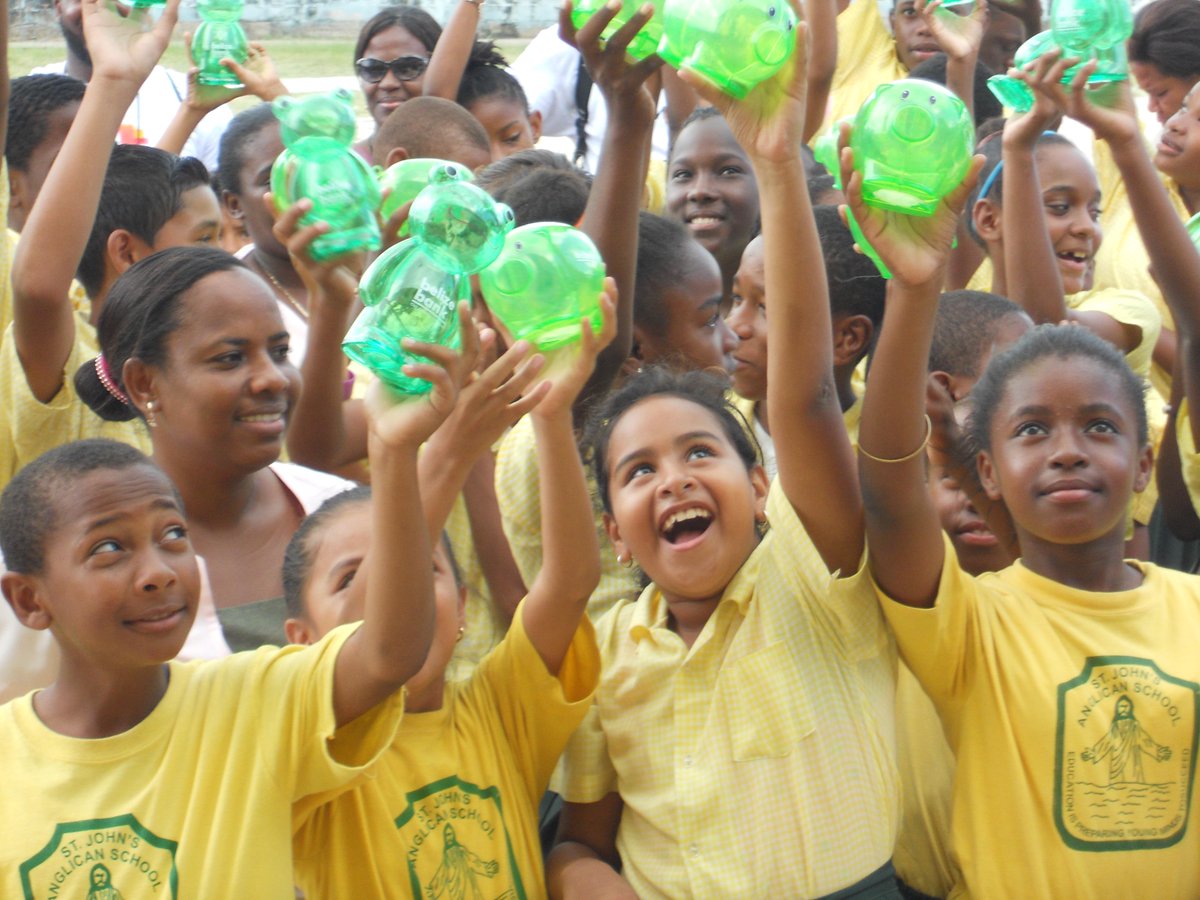 PwCUS's tweet image. Students at PwC&apos;s #ProjectBelize receive piggy banks as they learn about #FinLit