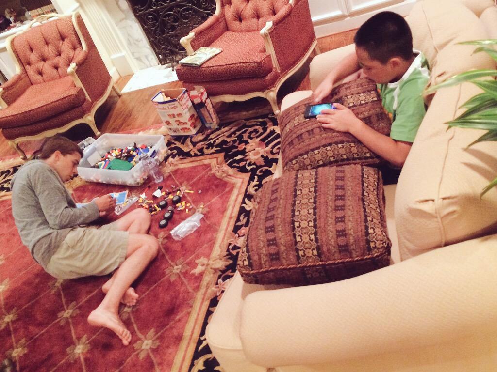 KaraYFincher's tweet photo. 9 year old on the phone. 24 year old playing w Legos.. yeaaaah sounds about right! #HostingExperience http://t.co/YRJt0uixEL