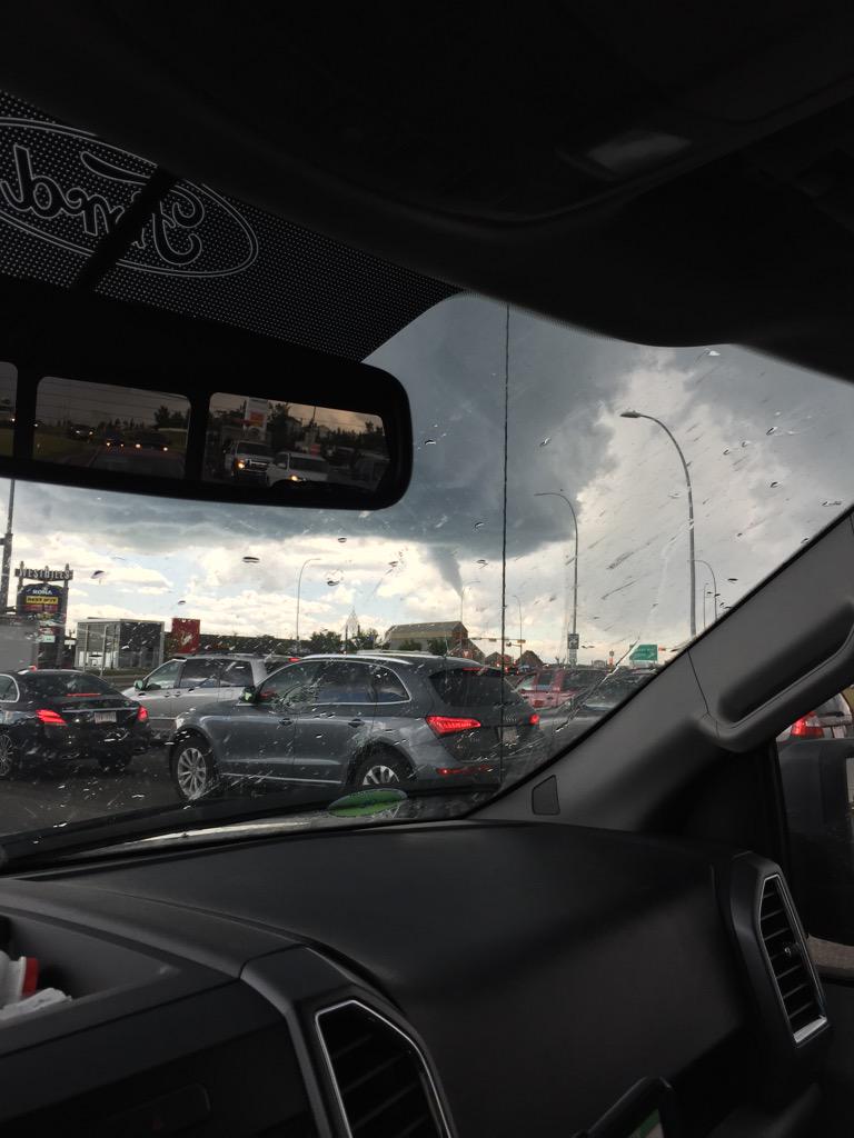 CalgaryKaizen's tweet photo. Funnel cloud at Westhill Shopping Centre. #ABStorm #YYC 12:56pm http://t.co/adYCAK4afJ