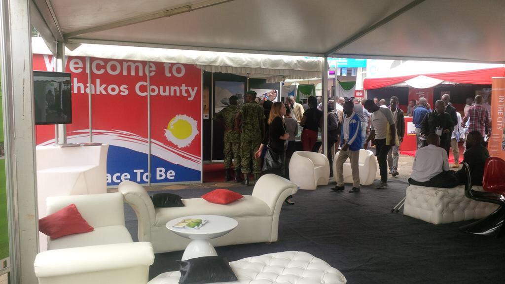 Funkdafied7's tweet photo. Machakos stand at the pre-GES at KICC. H.E @UKenyatta having a look at the Machakos new city model. @DrAlfredMutua http://t.co/LrvXBgyWWd