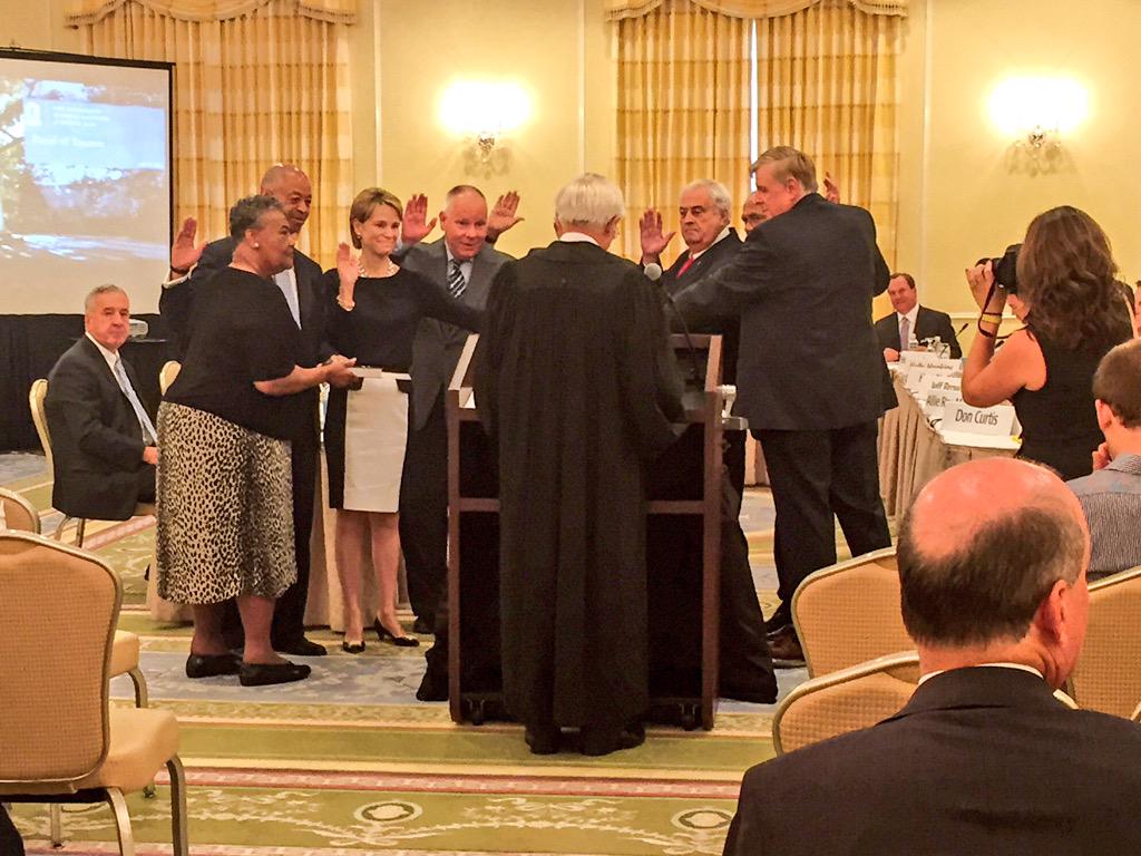 UNC's tweet photo. This morning's meeting begins with the swearing-in of five #UNC Board of Trustees members. http://t.co/JZWNjbxLhb