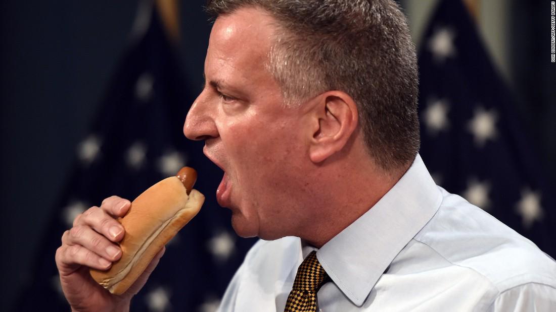 CNNPolitics's tweet photo. In honor of #NationalHotDogDay, here are some photos of politicians eating hot dogs http://t.co/spEm6HF8PA http://t.co/MORGqXLxQJ