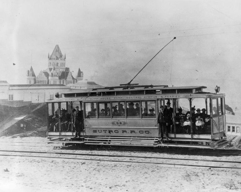 #TBT Circa 1898 for an old #SF summer past-time. Sutro RR car above the <a href="/sutrobaths/">Sutro Baths</a> and <a href="/CliffHouse/">Cliff House</a>, full of people.