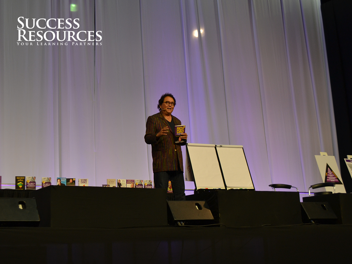 successressa's tweet photo. Gracing the stage as we speak is the wise and noble Robert Kiyosaki! #mowza http://t.co/sqIiXlfLxL