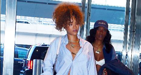 ELLEmagazine's tweet photo. Rihanna wore the absolute last pair of shoes you'd expect anyone to wear to the airport. http://t.co/PkhWbpkAki http://t.co/Vf9G0lpqIi