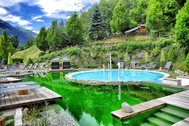 globalgrasshopr's tweet image. The beautiful heated and natural lake water garden pool of the @hoteltheresia #Austria #12hotels #visitaustria