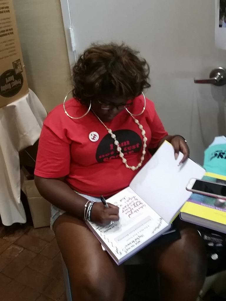 NancyOsborne180's tweet photo. @youth_dreamers signing book for my @PHSMandelaSoc students! #giveyouthavoice #BATCon2015 #TBATs http://t.co/i2PqaqTYlP