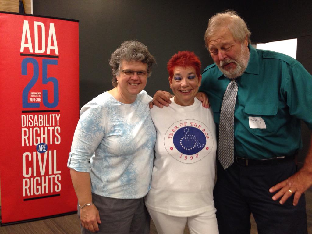 ACLgov's tweet photo. Kathy Greenlee celebrates #ADA25 at Lawrence (KS) Public Library w/longtime friends Martha Hodgesmith and Ray Petty http://t.co/6D778ra5P7
