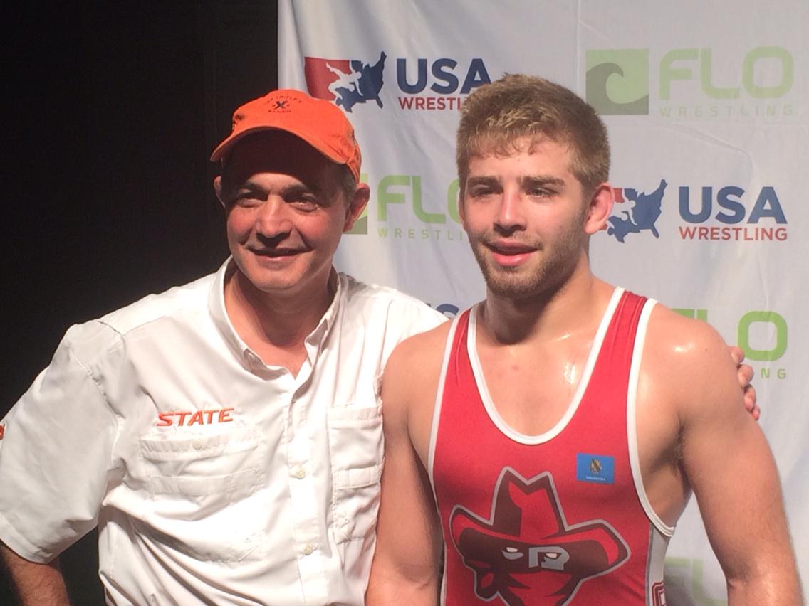 WINWrestlingMag's tweet image. OSU wrestling head coach w son Joe after first Jr FS title #fargo2015