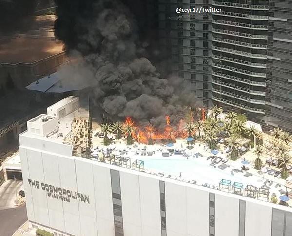 ABC's tweet photo. UPDATE: Fire rages at The Cosmopolitan Hotel as smoke rises above Vegas Strip: http://t.co/GXIL7krgRX http://t.co/iudwhUuj0d