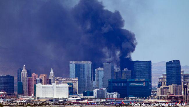 WOODTV's tweet photo. Fire erupts at swimming pool atop hotel on Las Vegas Strip: http://t.co/YOMaAZbxey http://t.co/8EUiN7Y1Ql