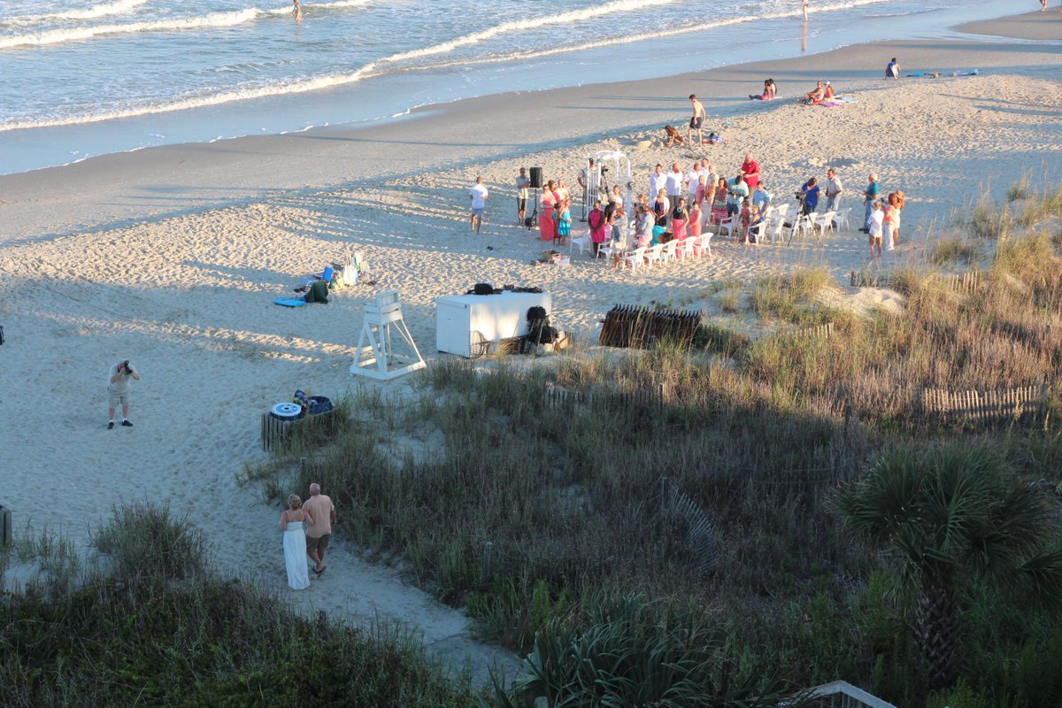 JohnZavinski's tweet photo. 2 weddings on the beach tonight. The possibilities for photo bombing seem endless. #HereComesTheTide #WhitecapsWeddng http://t.co/0RQYrkbkPd