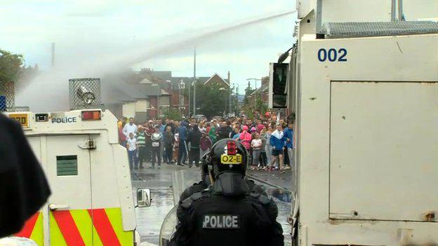 BBCNewsNI's tweet photo. VIDEO: Petrol bombs and missiles thrown at police after Belfast anti-internment parade http://t.co/bA3HMQ7uKd http://t.co/rYkG0xhHMx