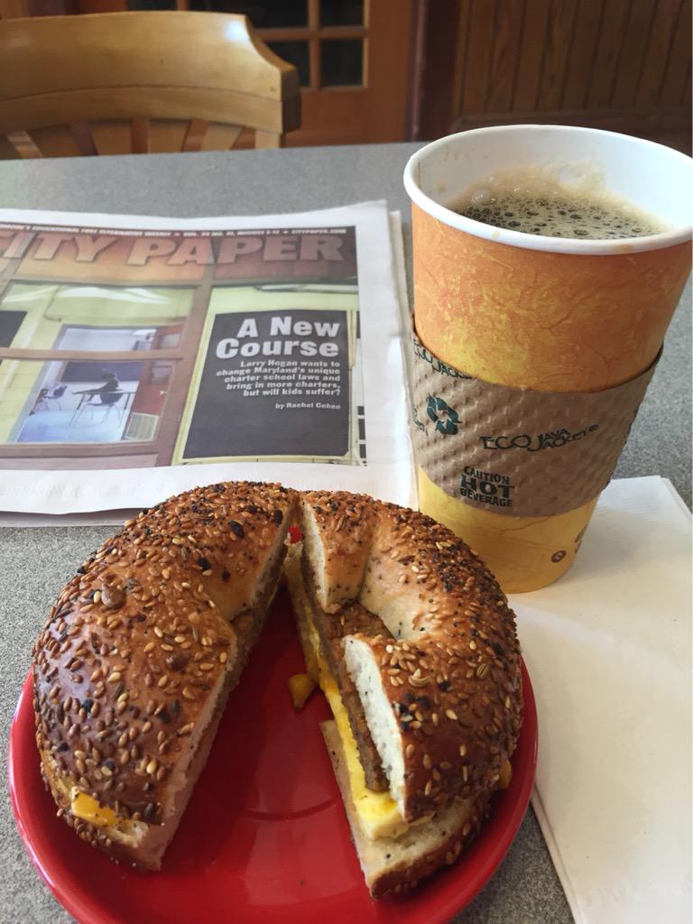 Starting the day off right- <a href="/ZekesCoffee/">Zeke's Coffee</a> and bagel at Cafe Jovial in <a href="/PigtownBmore/">Pigtown News</a>, while reading <a href="/city_paper/">Baltimore City Paper</a>.