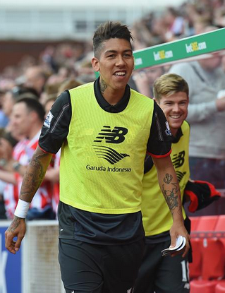 Firmino warms up before his introduction to the Stoke match