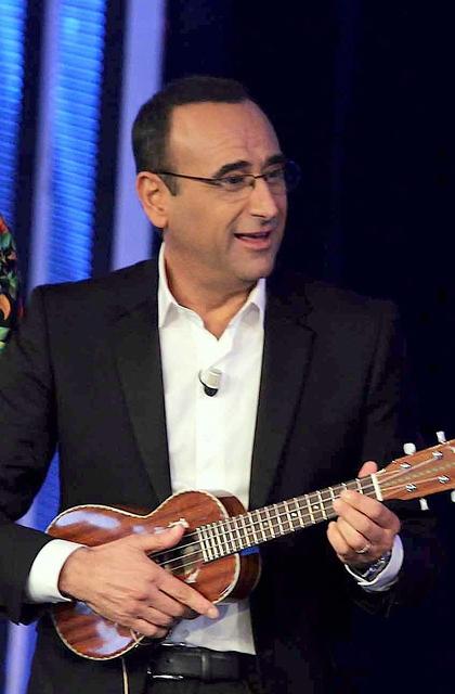 carlofacose's tweet photo. Carlo Conti che suona in una band rock http://t.co/oo7Lc84yQq
