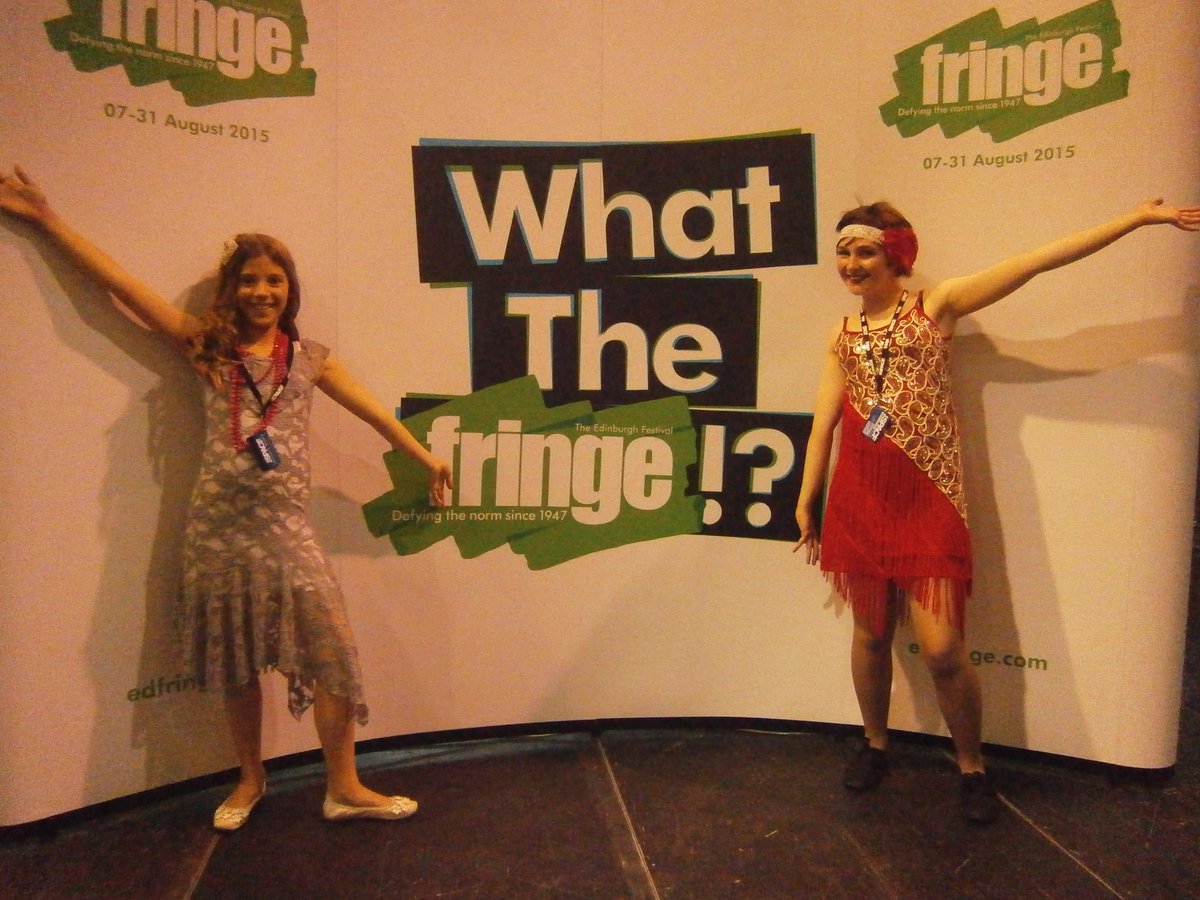 Shortspeare's tweet image. We were at @FringeCentral today, such an awesome place! Here's Adriana and Luciana posing with the #WTFringe poster!