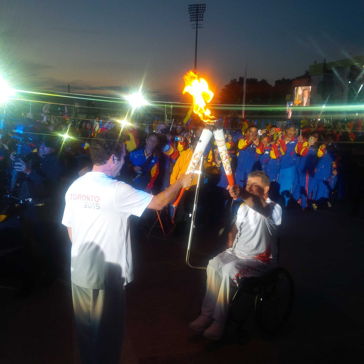 matthewcutler's tweet photo. From one Rick to another. @RickMercer and @RickHansenFdn pass the #ParaTough #PanAmazing flame. http://t.co/jyXttIDQph