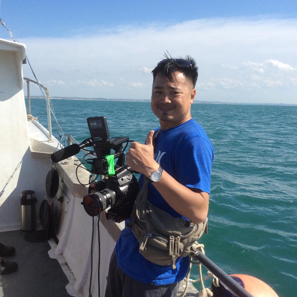 swim4starlight's tweet photo. Cameraman Jeff Tseng from Pixel Frame with France in the background. http://t.co/eSwSZoi4r4