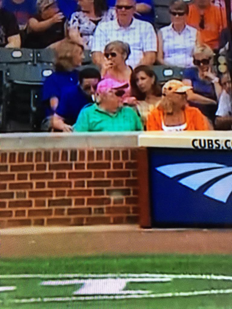 cubs fan in pink hat