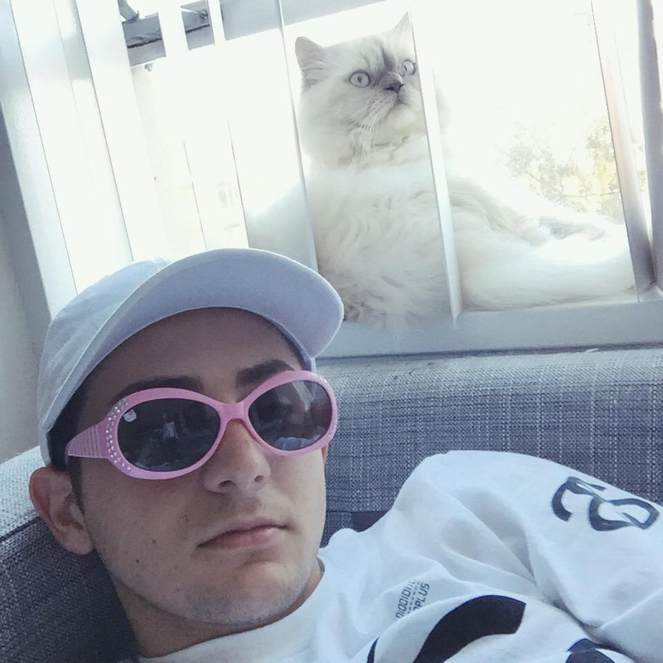 twaimz's tweet photo. here's a picture of me and a cat you're welcome http://t.co/FMb9a2TIZp