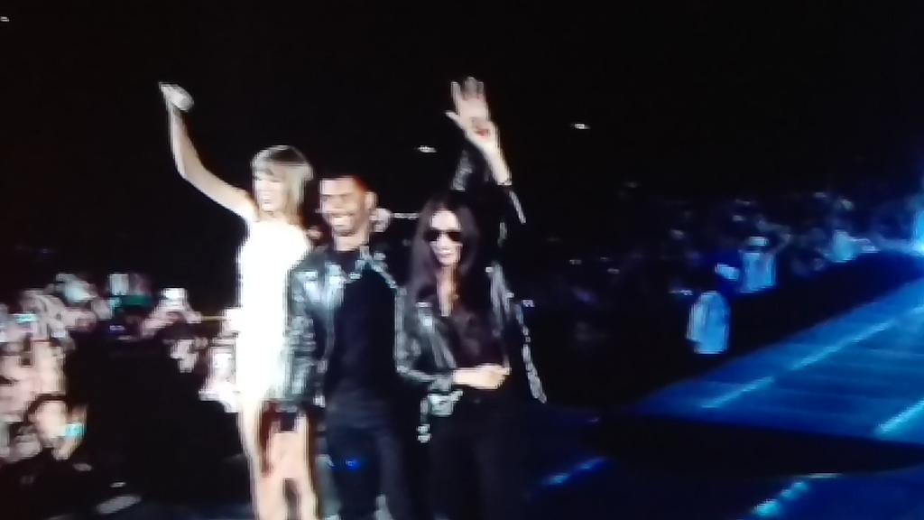 Russell Wilson on stage with Taylor