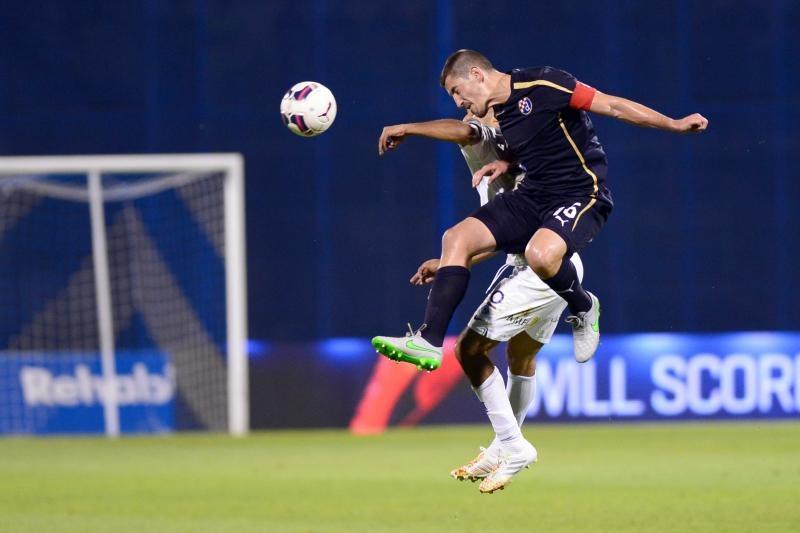 Ademi heads the ball during the game Ademi heads the ball during the game