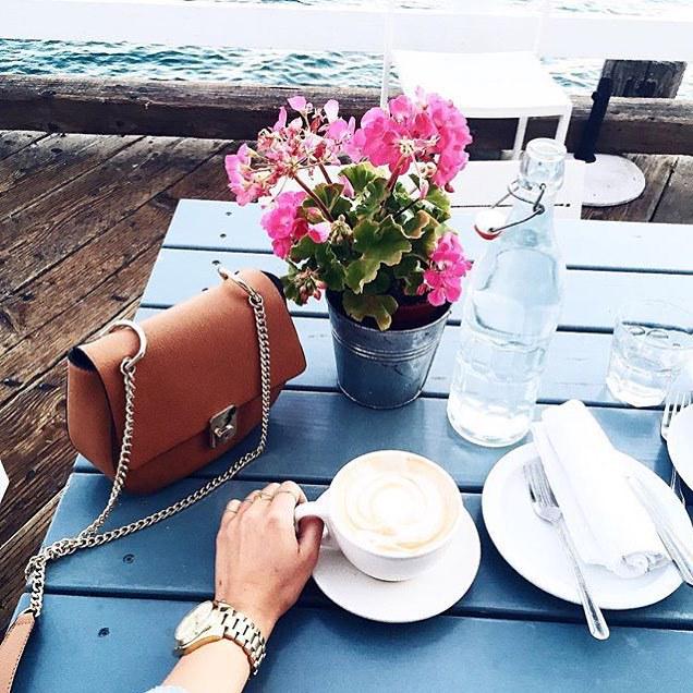 Having coffee by the seaside is how we want to start everyday 🌷 <a href="/rozachka/">Rose Brashkis</a> is wearing <a href="/michaelkors/">Michael Kors</a> watch and <a href="/foreve/">Miguel Eccard</a>…