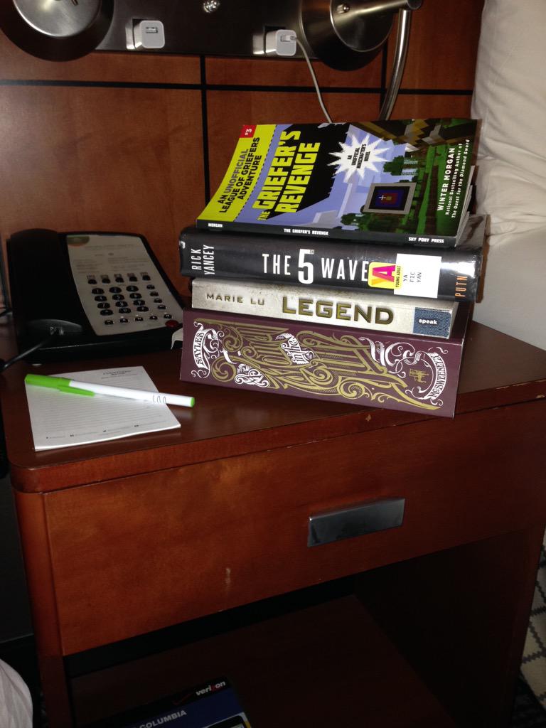 What a reading family's hotel nightstand looks like!