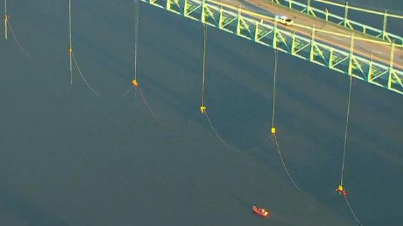 NBCNews's tweet photo. More than a dozen protesters are dangling from a Portland bridge http://t.co/t5qjtPYqpw http://t.co/xyka4fF5FZ