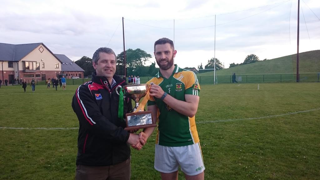 Louth GAA Chairman Des Halpenny presents the Senior Hurling League Final cup to Pearse Og captain Shane Callan