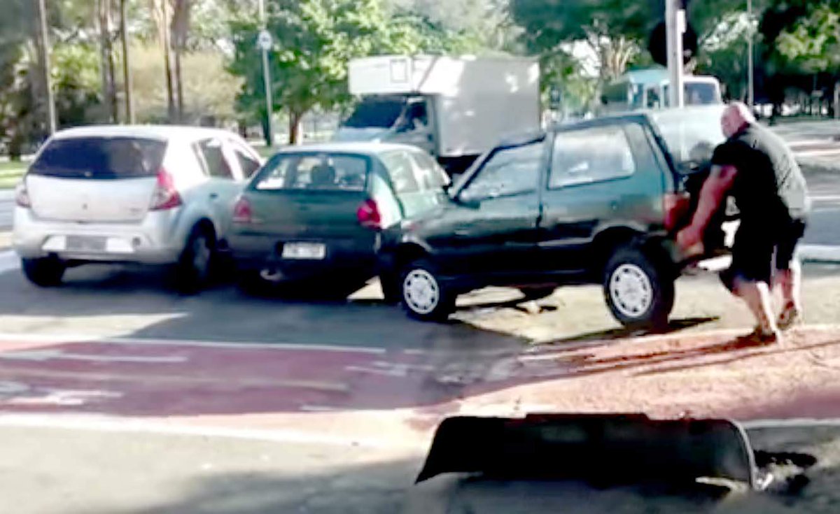abcnews's tweet photo. #ICYMI: A superhuman cyclist lifts a car out of a bike lane and casually rides away http://t.co/IPB9CiMS4c http://t.co/nsXtFaq0uT