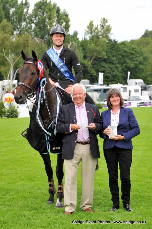 Adrian Whiteway &amp; Cojack, winners of the 1.25m SEIB Winter Novice Championship at the @LonginesEq Royal International