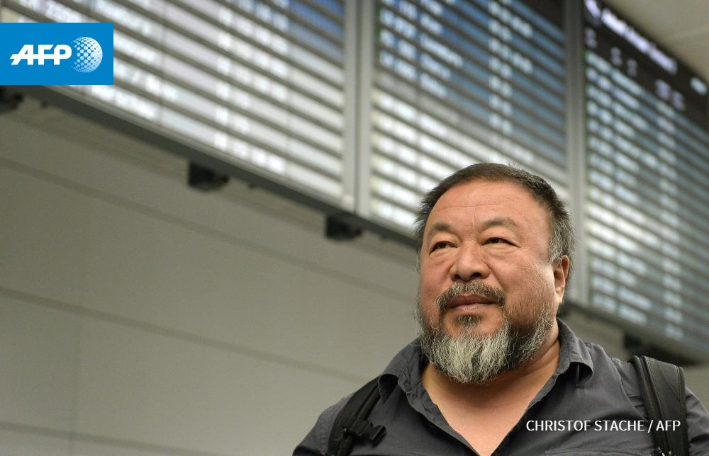 afpfr's tweet photo. L’artiste chinois AI Weiwei en Allemagne après quatre ans sans passeport http://t.co/pO7pgGTWN6 #AFP http://t.co/1dtrKR2tXx