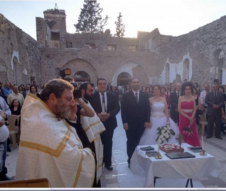 KofC's tweet photo. This Syrian couple showed that faith is still alive when they married in church ruins #Faith http://t.co/n1bDh0TbRK http://t.co/A4BycMIzHL