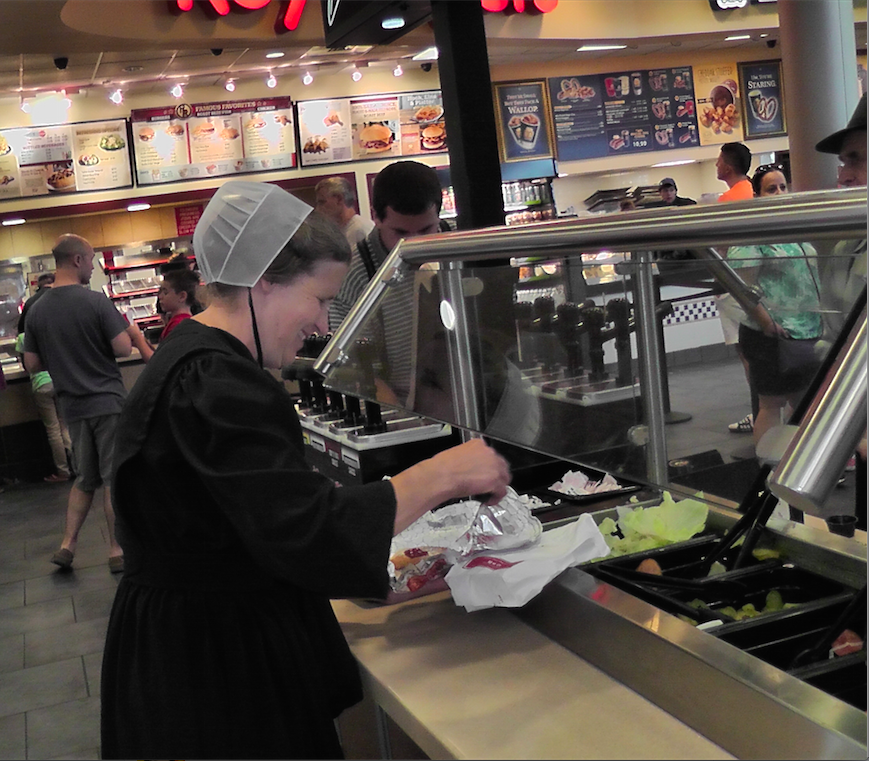 TheresaAFallon's tweet photo. At #reststop in #Pennsylvania met charming #Menonite woman putting toppings on her hamburger from Roy Rogers |#USA http://t.co/mt7ym8FO7m