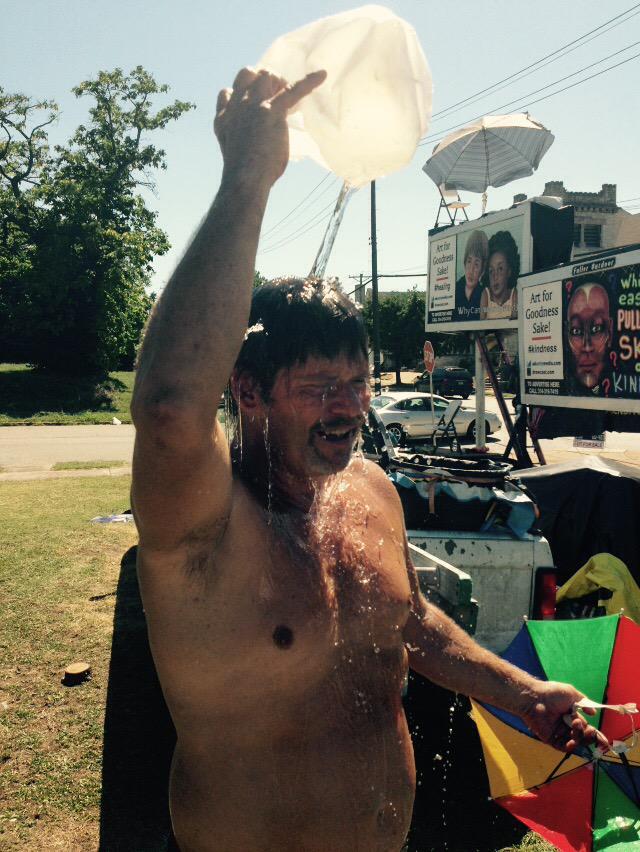 Billboard Sitter Daniel Boone Fuller takes a quick bath as he teaches day 5 without a killing. Needs 7 to quit.