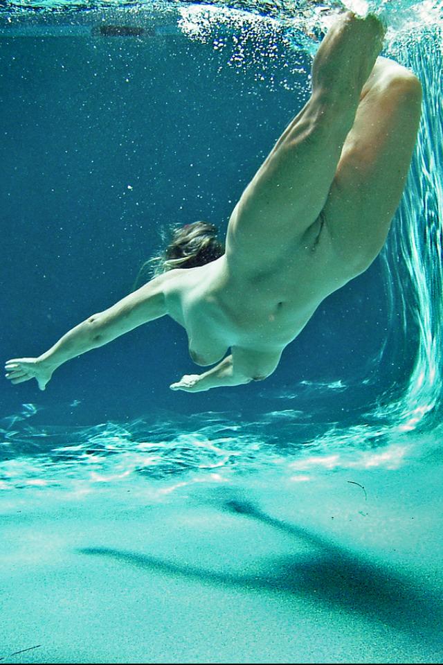 Nude girls imageed swimming underwater